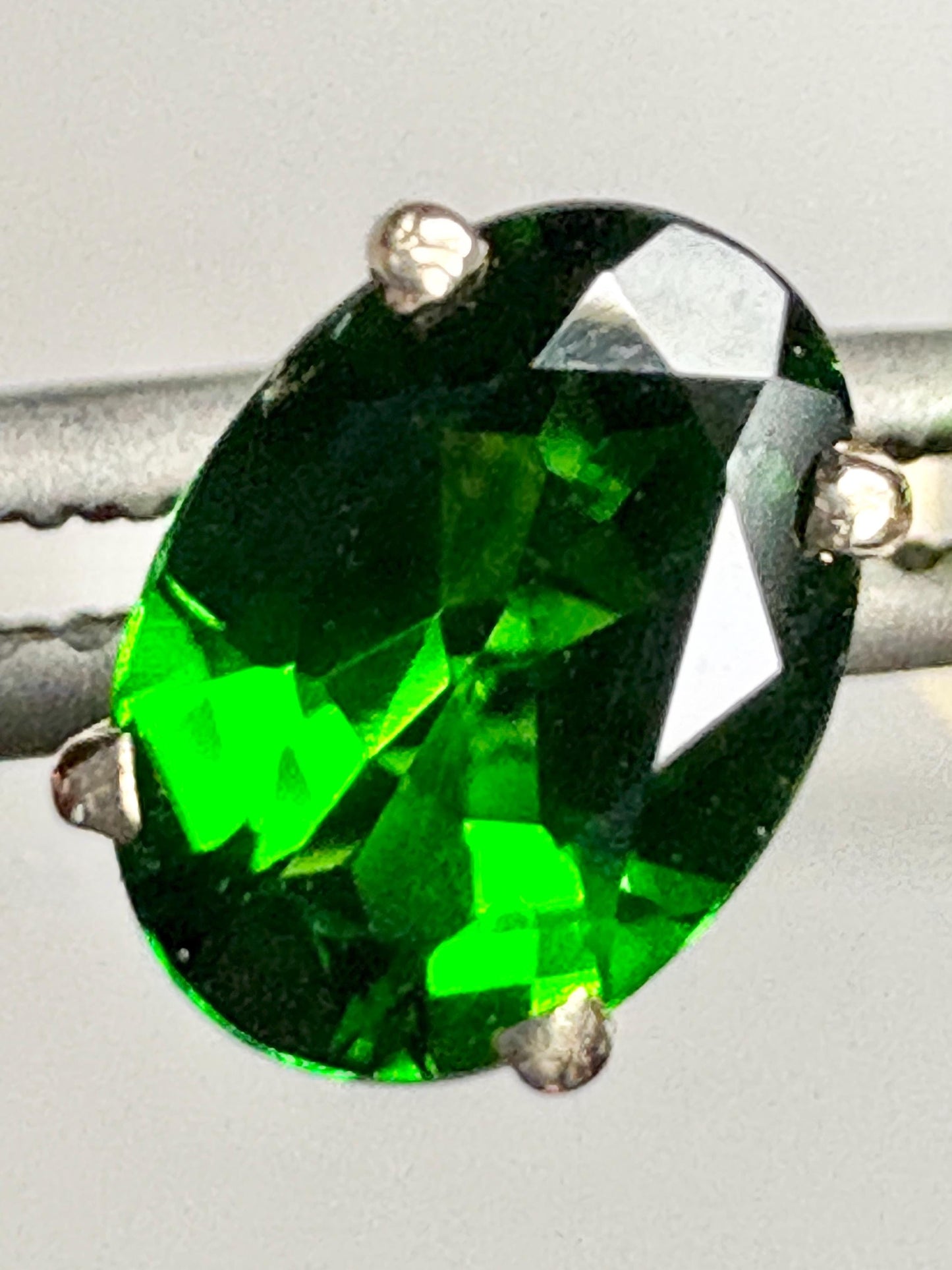 Oval chrome diopside stud earrings set in 14k gold.