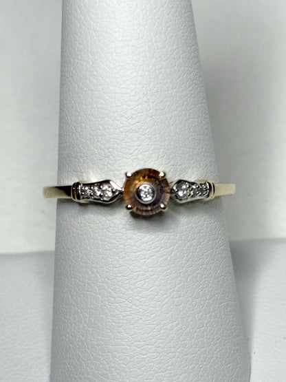 A Montana sapphire Lehrer cut ring with diamonds in 9k gold.
