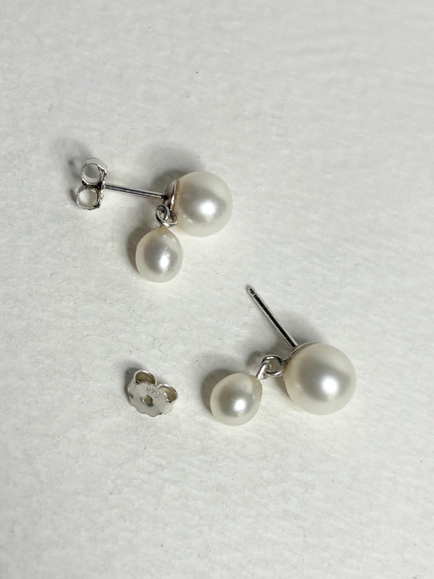 Sterling silver dangle earrings with vintage freshwater pearls.