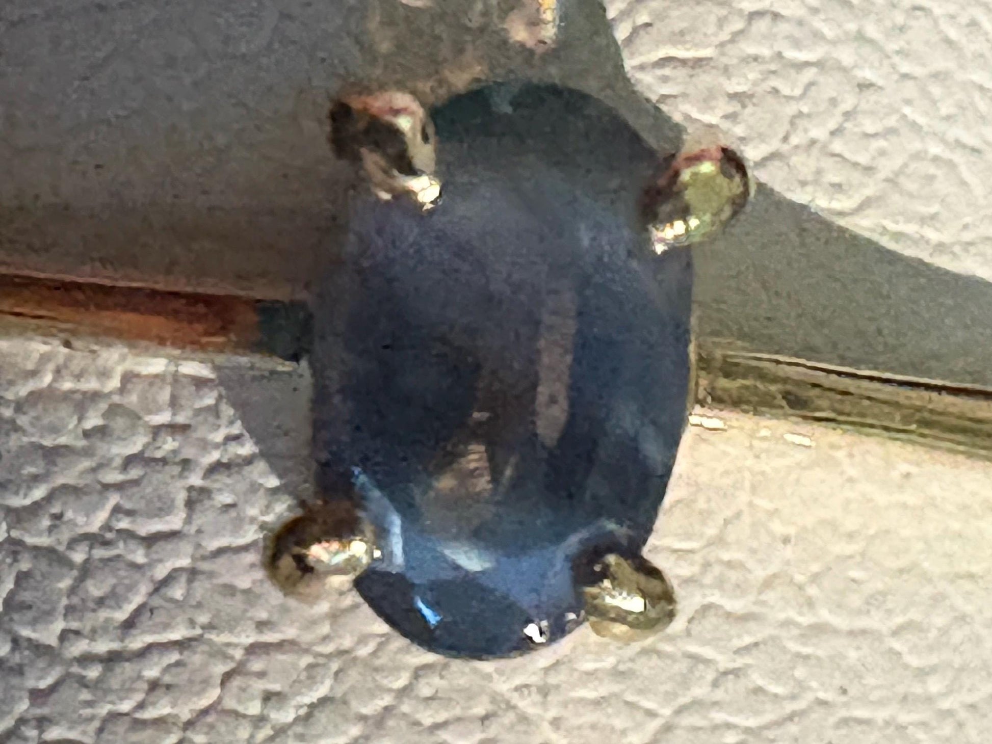 Oval alexandrite chrysoberyl solitaire ring in 10k gold.