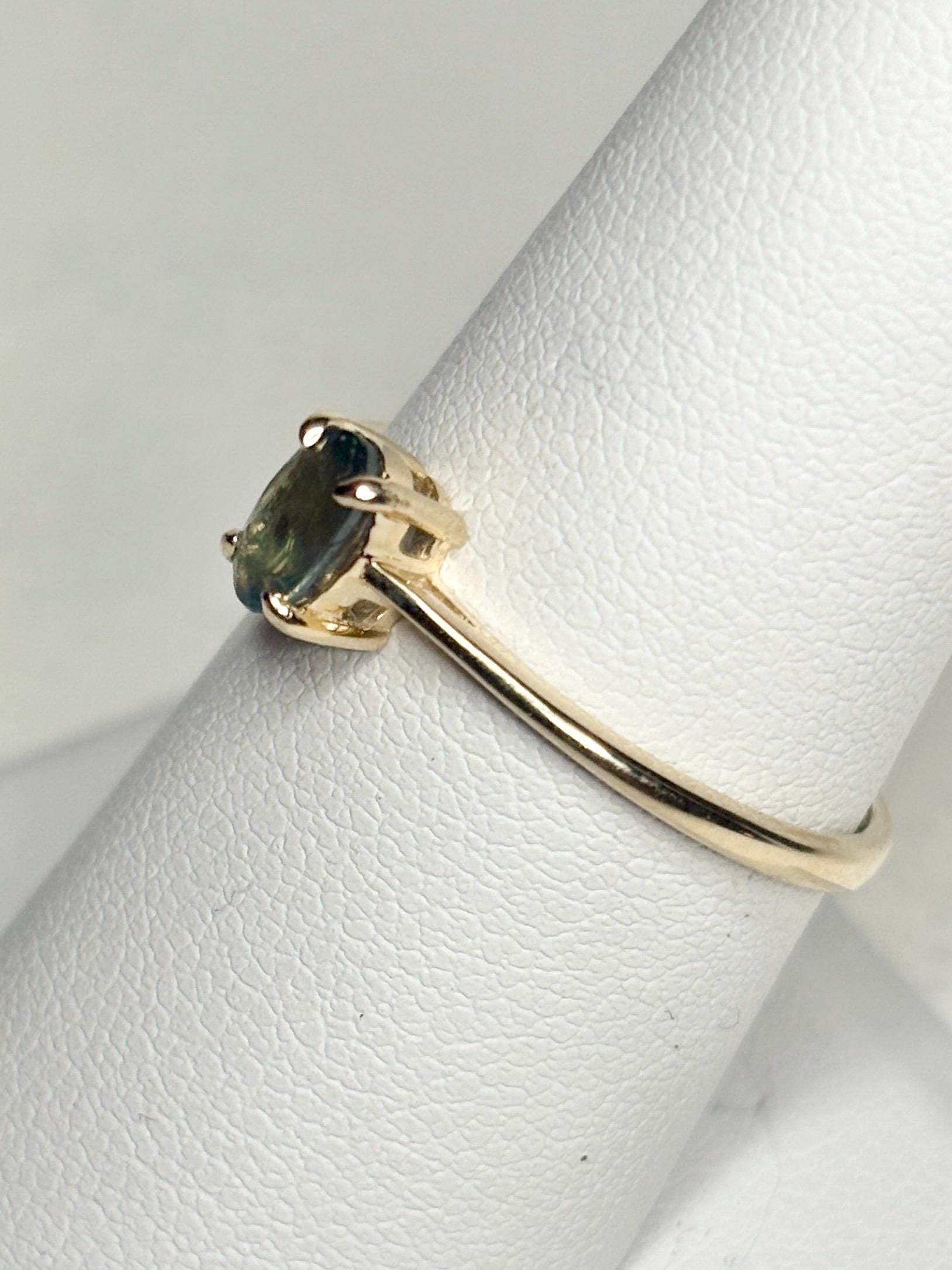 Oval alexandrite chrysoberyl solitaire ring in 10k gold.