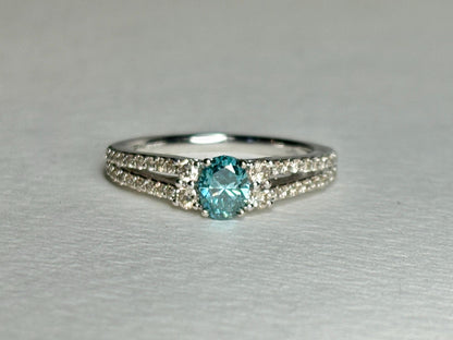 LeVian 14k white gold ring with a blue diamond and champagne diamonds.