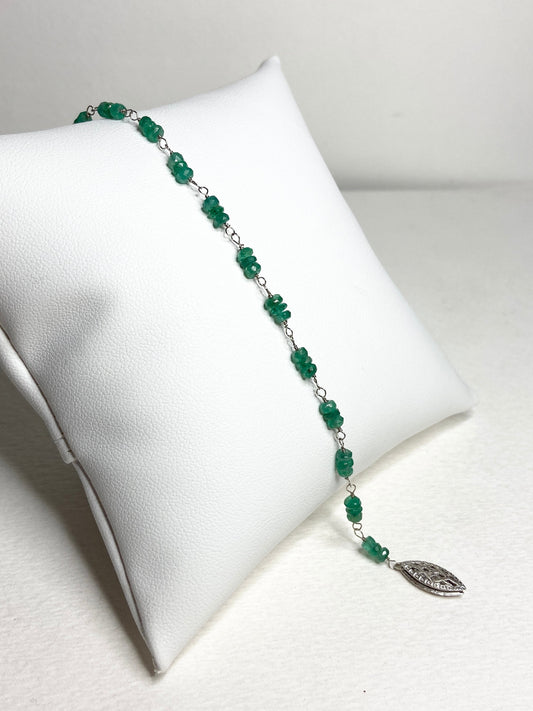 A 7.5 inch bracelet with natural emerald beads and a white gold clasp.